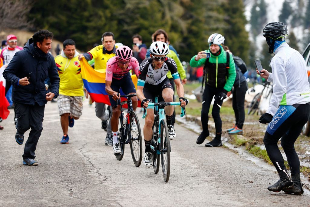 Team BikeExchange rider Great Britains Simon Yates R and overall leader Team Ineos rider Colombias Egan Bernal ride in the final ascent during the 14th stage of the Giro dItalia 2021 cycling race 205km between Citadella and Monte Zoncolan on May 22 2021 Photo by Luca Bettini POOL AFP Photo by LUCA BETTINIPOOLAFP via Getty Images