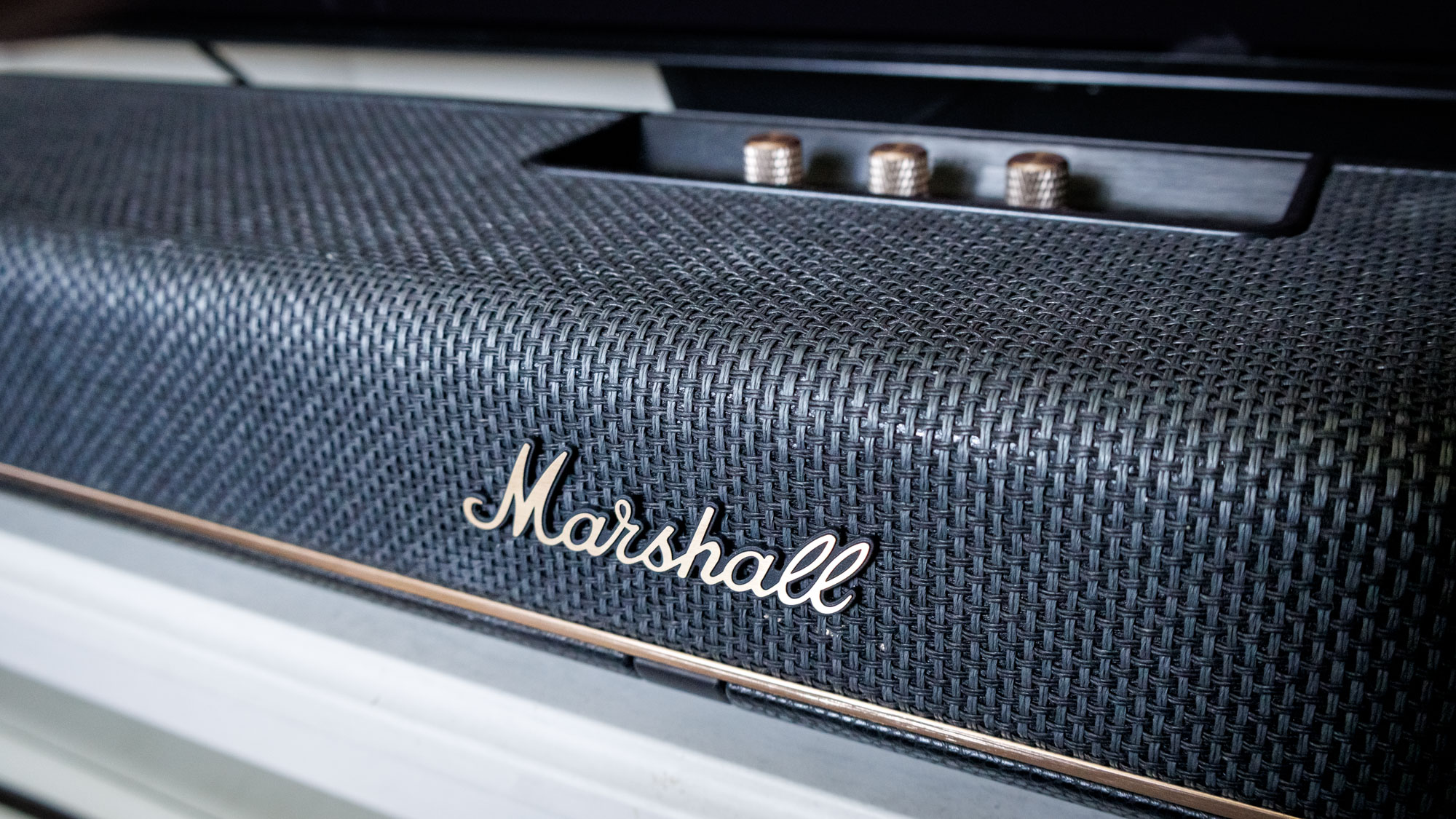 The logo on a Marshall Heston 120 soundbar.