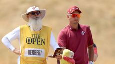Lucas Herbert (right) and his caddie Nick Pugh look at a shot during round three of The Open in 2026