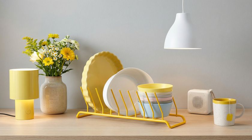 Collection of yellow and white IKEA kitchen accessories on counter