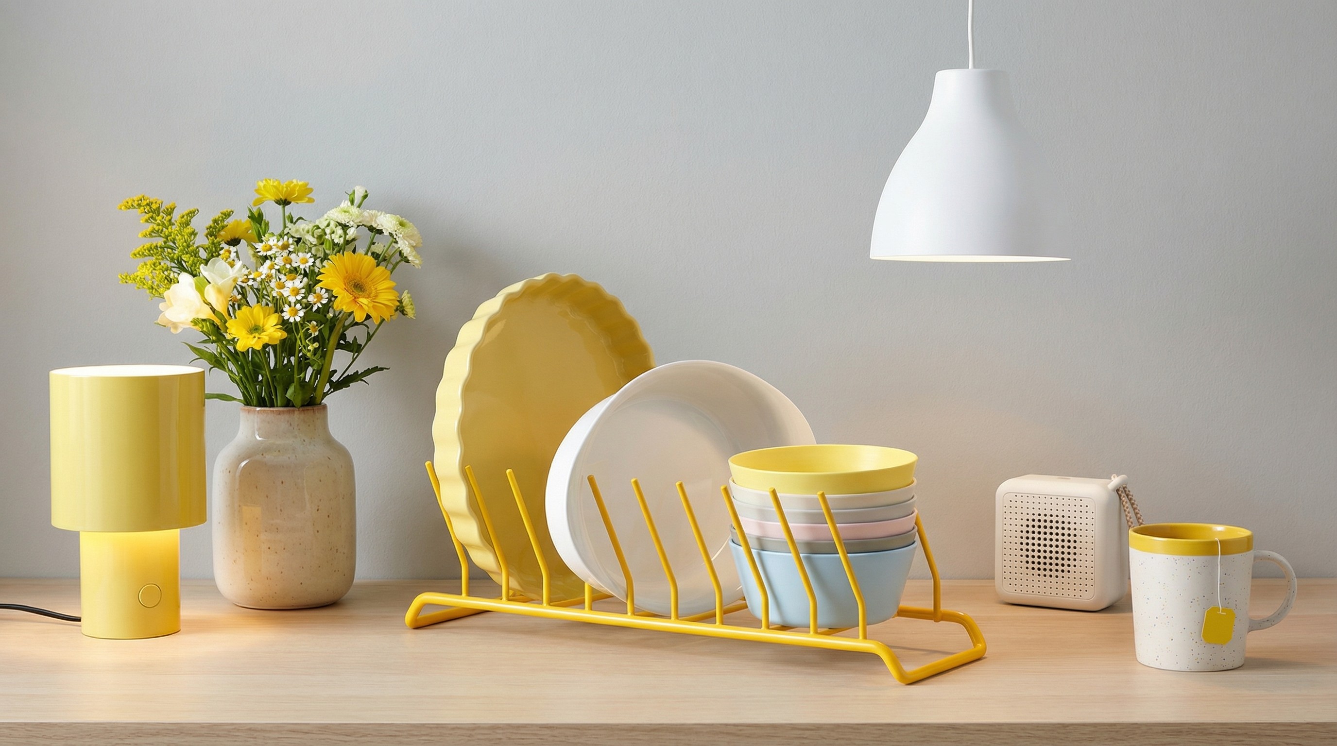 Collection of yellow and white IKEA kitchen accessories on counter