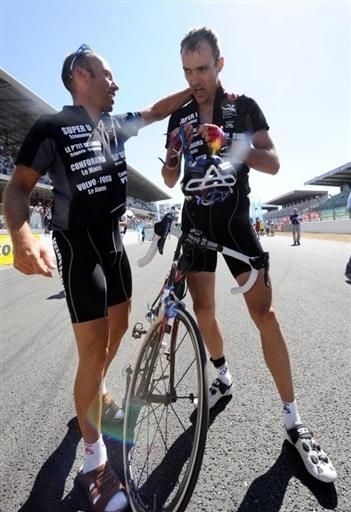 Riders from the winning team start celebrations after a long, hard race.