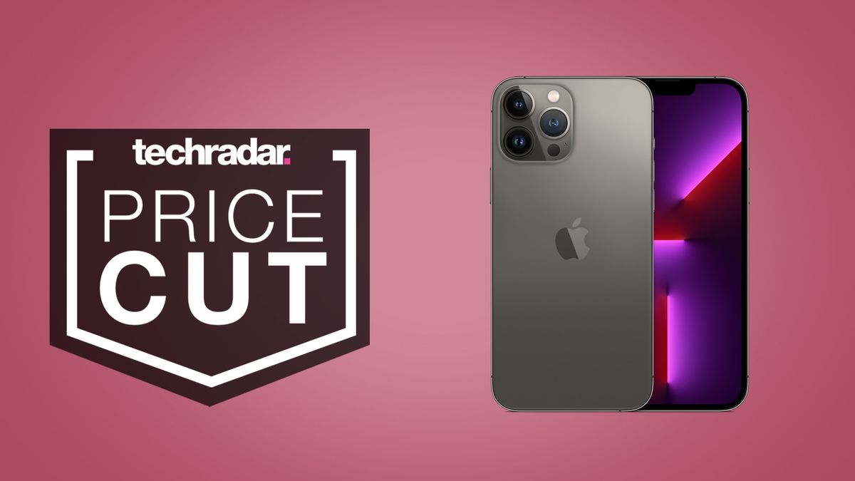 iPhone 13 Pro Max in black on light pink background, beside text that reads &#039;price cut&#039;