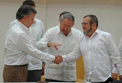 Colombian President Juan Manuel Santos, left, and FARC leader Rodrigo Londono.