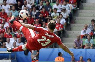 Xherdan Shaqiri scores an overhead kick for Switzerland against Poland at Euro 2016.