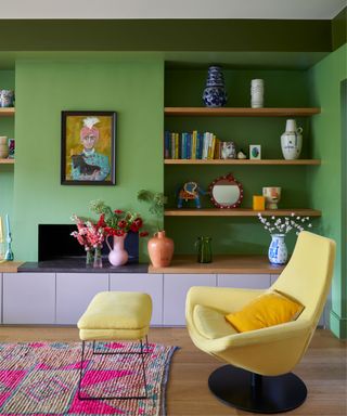 green living room with open shelving and yellow armchair
