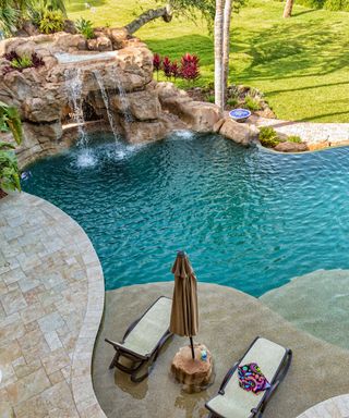 pool grotto with sun loungers