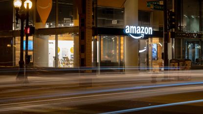  Cars passing the Amazon E-commerce pick up store early in the night in the Loop.