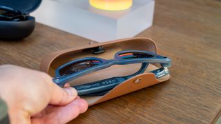 Taking Ray-Ban Meta smart glasses out of the new charging case