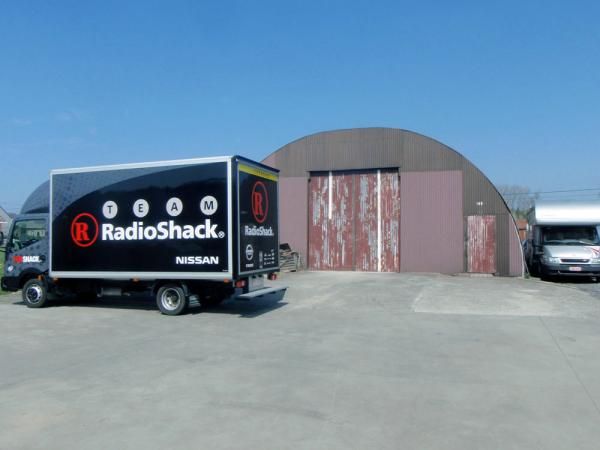 The team's small mechanical truck still has room for a washing machine and up to 20 bikes