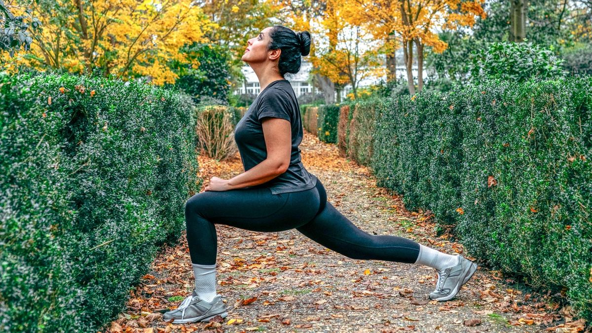 woman stretching into a forward lunge