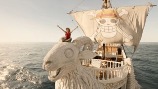 Luffy sitting on the prow of the Going Merry ship in One Piece