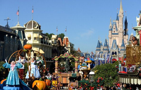 A parade goes down Main Street at the Magic Kingdom.