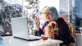 Woman and dog video chatting