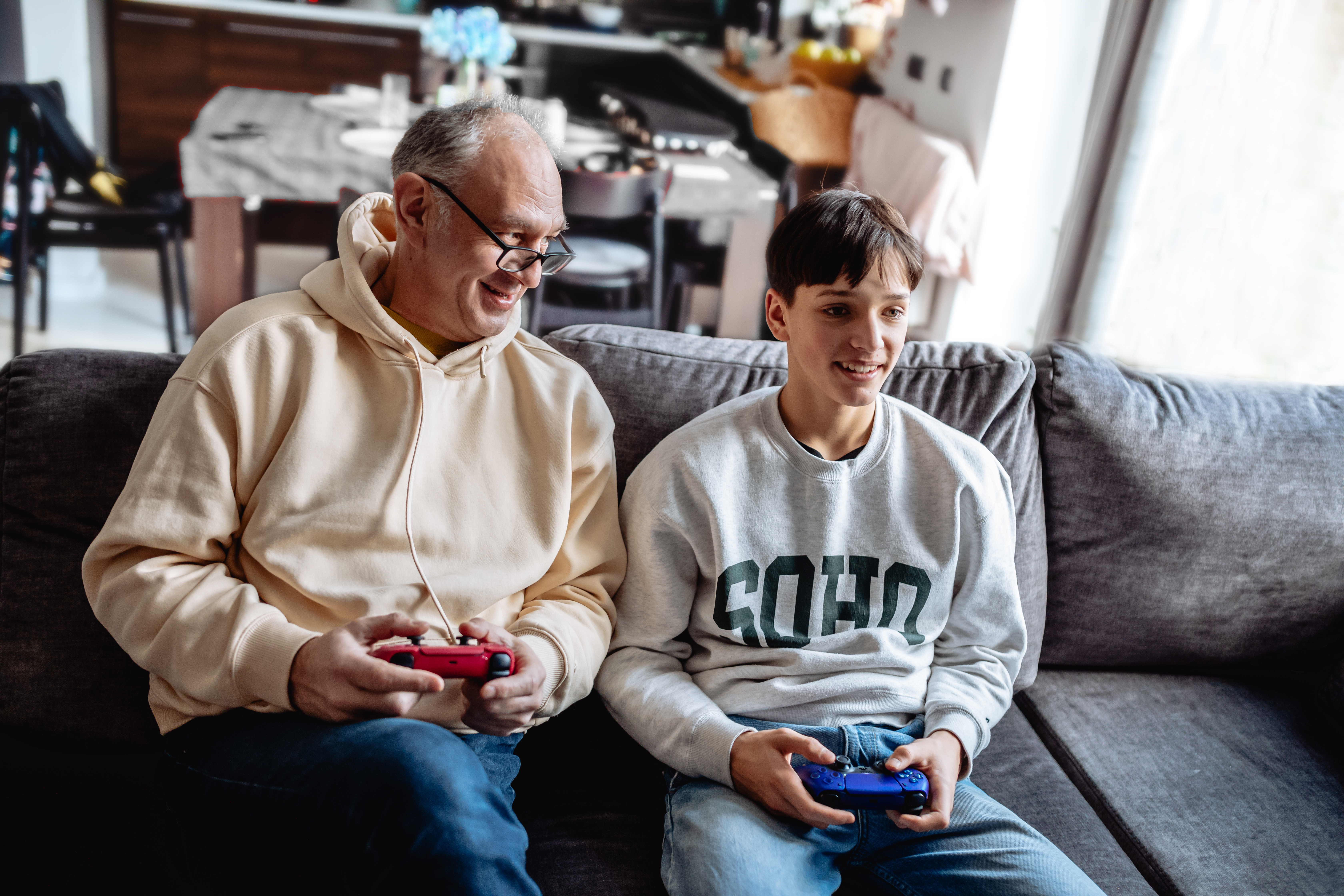 father and son playing video games