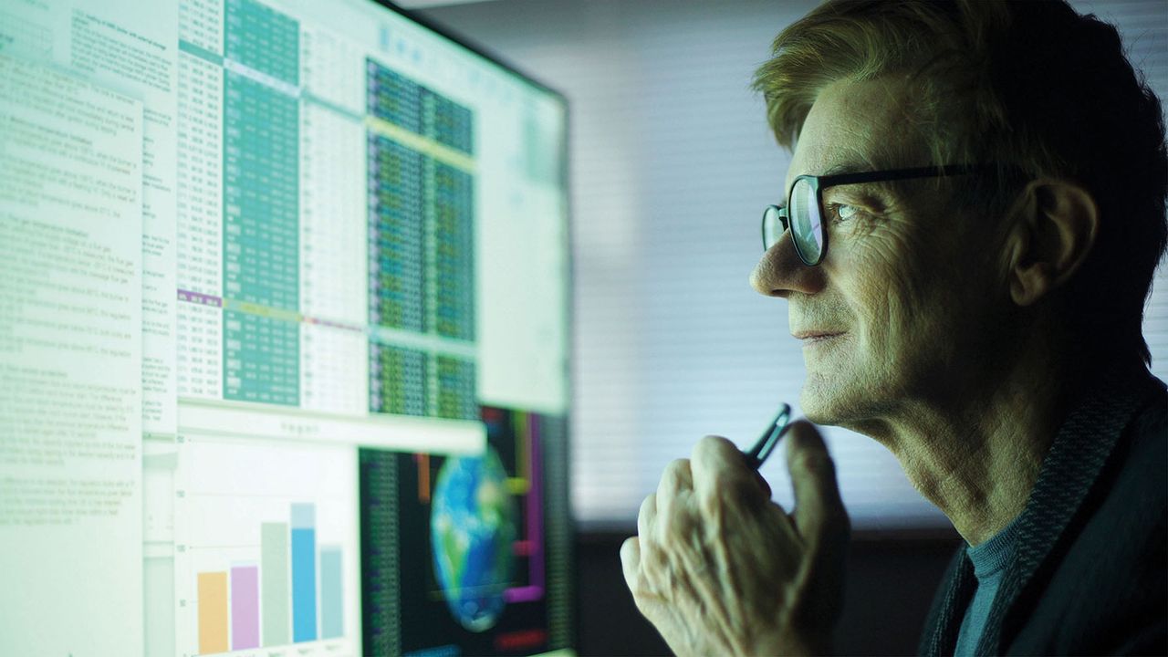 Man looking at a computer