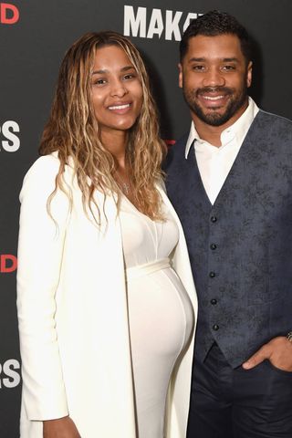 Ciara posing with her husband wearing no makeup