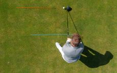 How To Aim In Golf: Golfer using alignment sticks to practice their aim