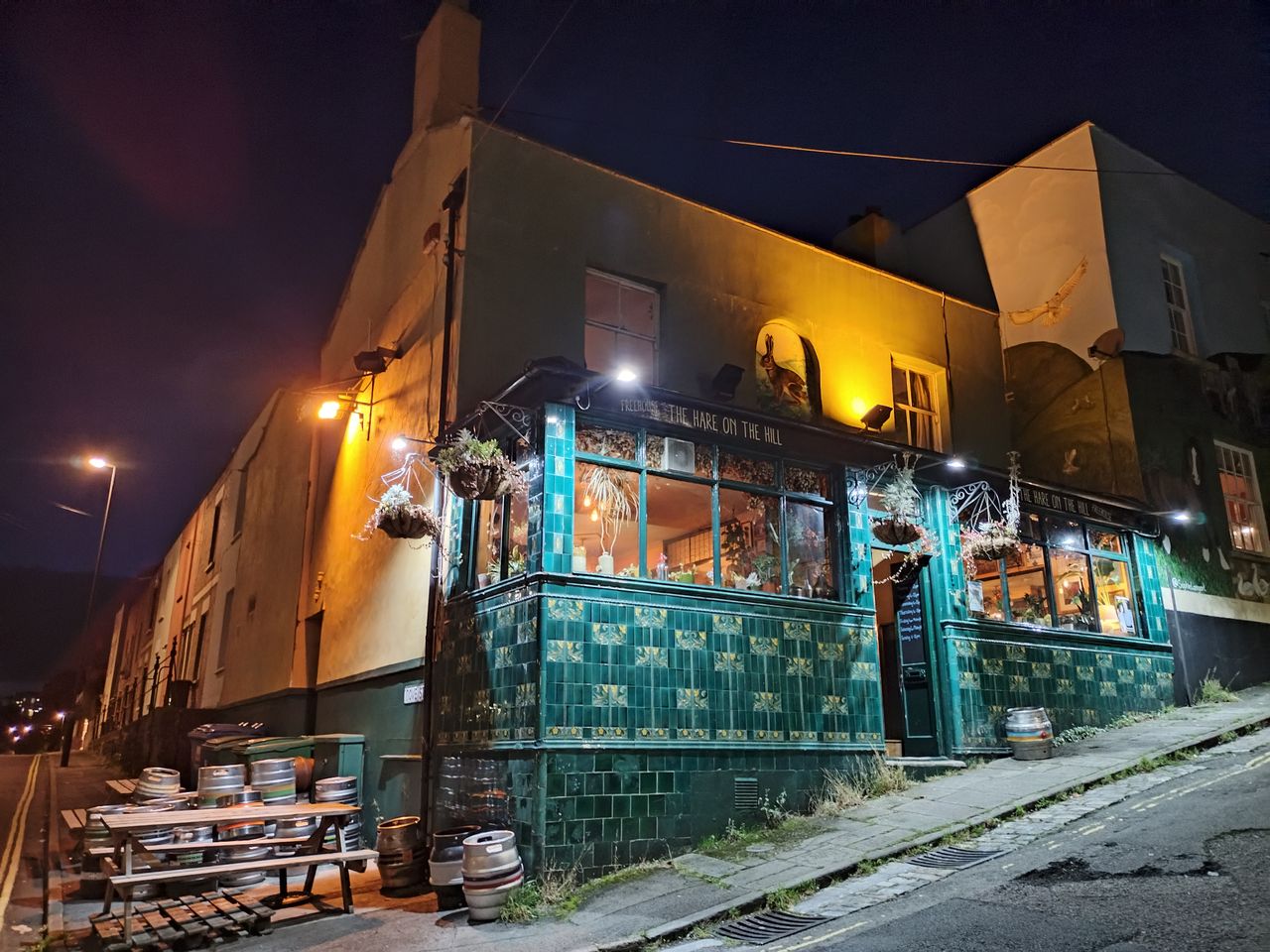A photo of the outside of a pub at night