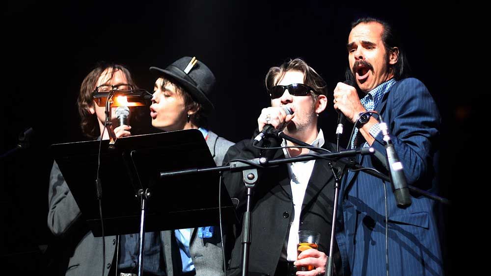 A photo of Nick Cave, Shane MacGowan, Jarvis Cocker and Pete Doherty on stage at Meltdown Festival in 2007