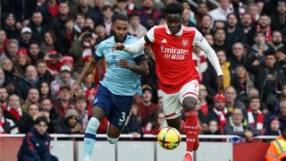 Arsenal's Bukayo Saka battles with Brentford's Rico Henry during the Premier League match on Feb. 11, 2023