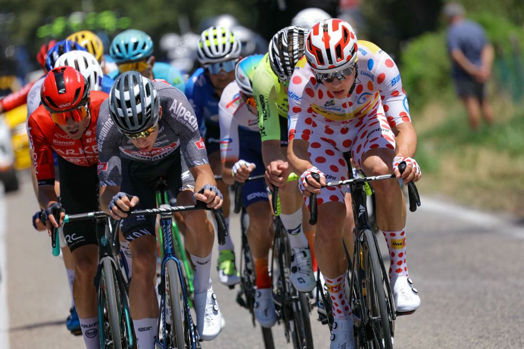 Arkea - B&amp;B Hotels team's Colombian rider Cristian Rodriguez (L), Alpecin-Deceuninck team's Belgian rider Axel Laurance (2nd L), and Uno-X Mobility team's Norwegian rider Jonas Abrahamsen wearing the climber's polka dot (dotted) jersey (R) cycles during the 2nd stage of the 111th edition of the Tour de France cycling race, 199 km between Cesenatico and Bologna, in Italy, on June 30, 2024. (Photo by Thomas SAMSON / AFP)