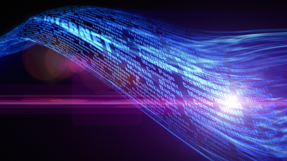 Conceptual image of the internet with a glowing wave of many words flowing over a black background.