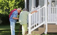 Older couple getting up the stairs 