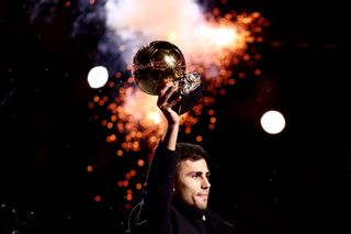 Rodri of Manchester City holds up his ballon d'or award prior to the Premier League match between Manchester City FC and Tottenham Hotspur FC at Etihad Stadium on November 23, 2024 in Manchester, England.