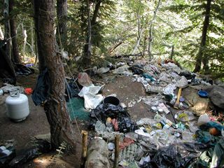 Trash accumulated by growers at a marijuana grow site raided by the U.S. Forest Service and other agency law-enforcement officers