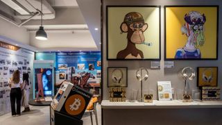 The physical artwork of "Bored Ape #2967" created by Bored Ape Yacht Club, left, and "Mutant Ape #1933" created by Mutant Ape Yacht Club, both available for sale as an NFT, displayed at a CoinUnited cryptocurrency exchange in Hong Kong, China.