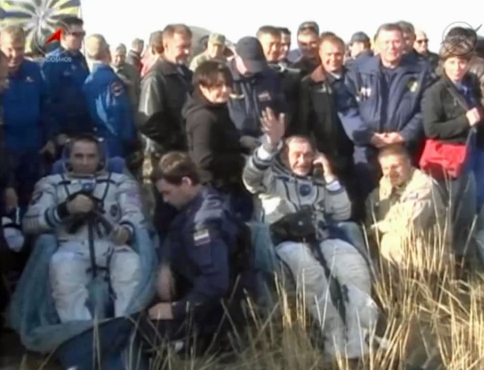 Russian cosmonaut Pavel Vinogradov (right) waves to cameras alongside NASA astronaut Chris Cassidy after a successful Soyuz landing in Kazakhstan on Sept. 10, 2013 EDT (Sept. 11 local time), ending a five-month mission to the International Space Station. 