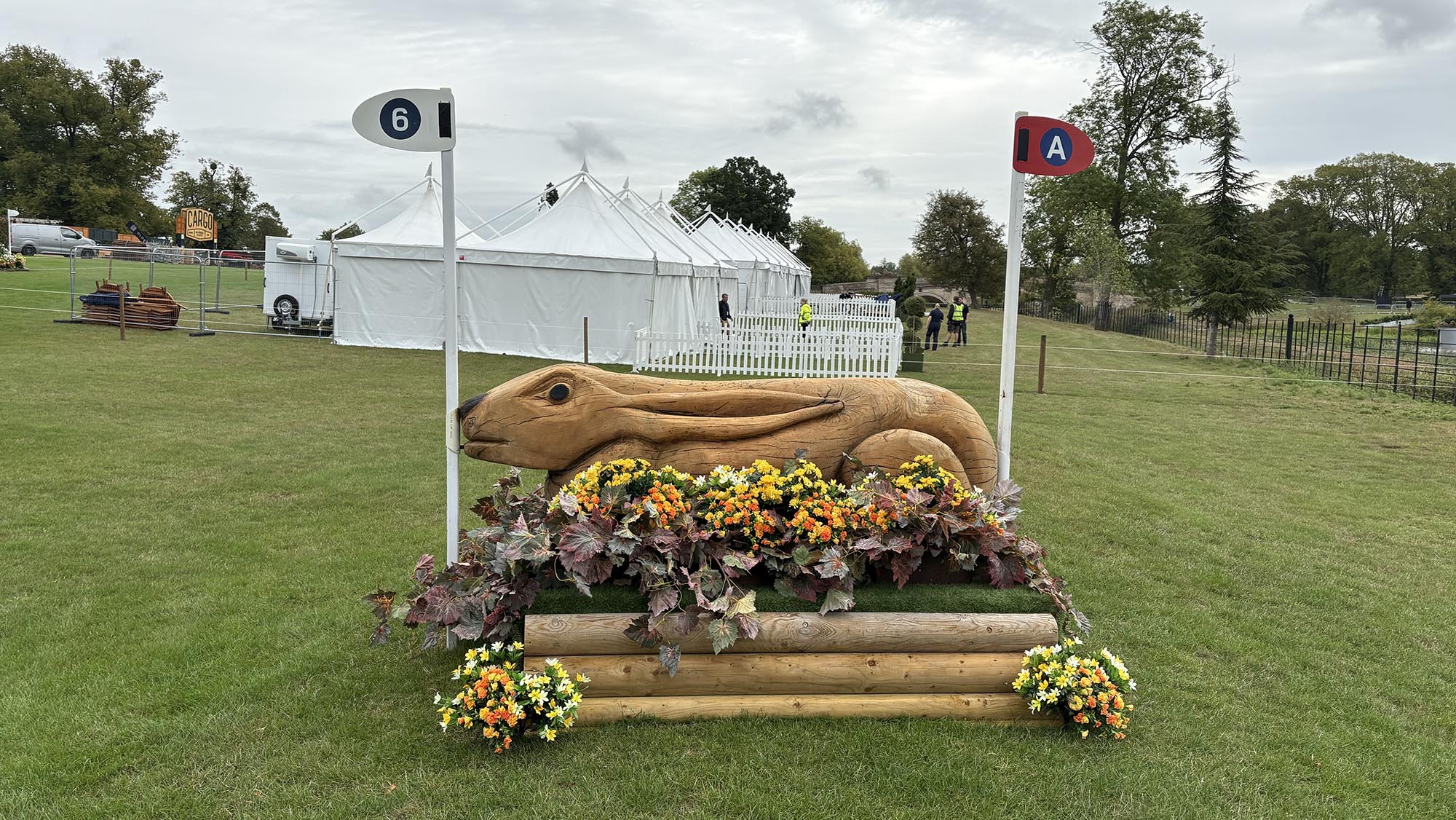 Narrow wooden fence carved like a hare on the Burghley cross-country course 2026