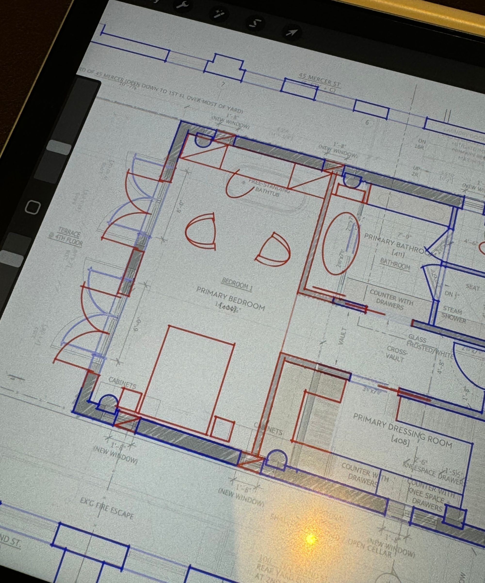 Close up up of tablet showing a digital floorplan of a home
