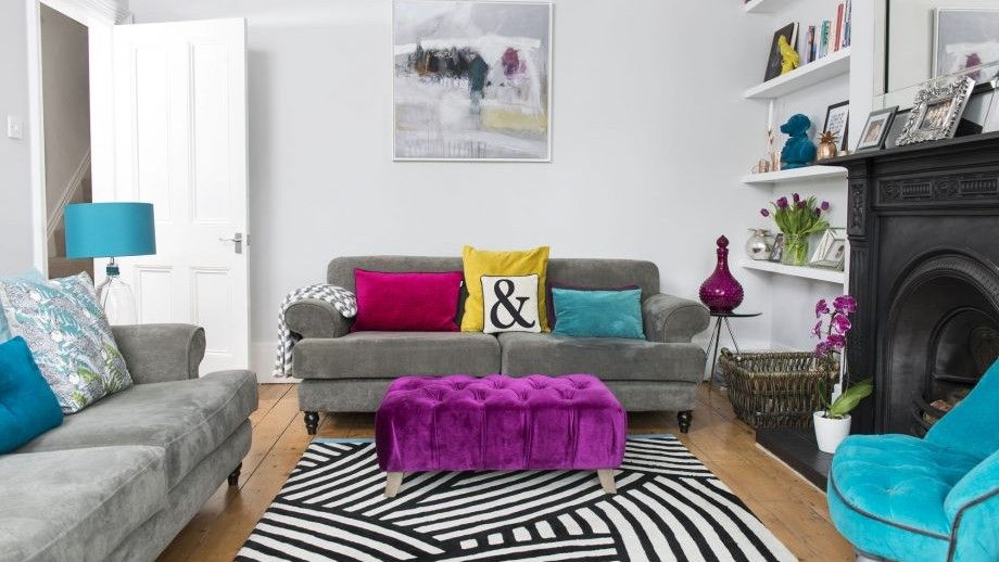 living room with grey sofa and white wall