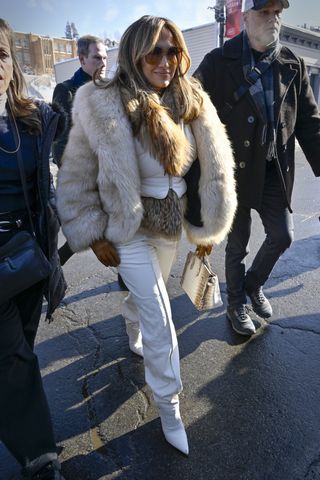 Jennifer Lopez wears a fur coat and carries her himalayan birkin in Park City