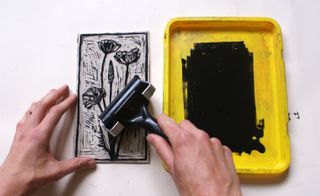lino printmaking: roll ink onto the lino