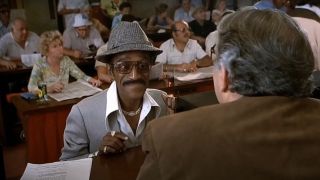 Sammy Davis Jr smiling at the betting desk in The Cannonball Run.