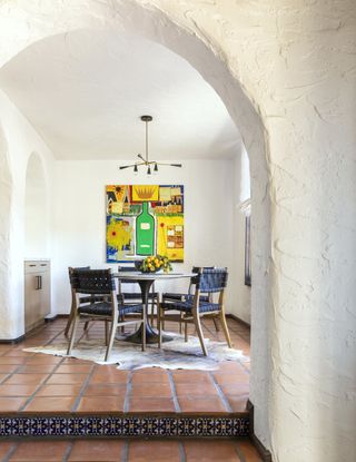 Rustic dining nook with texture walls and tiled floor