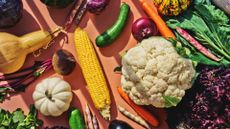 A selection of fibre-rich foods to beat the autumn slump, including cauliflower, onions and starchy vegetables