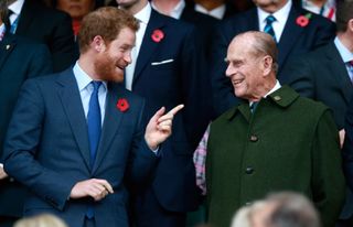Prince Harry and Prince Philip laughing in 2015