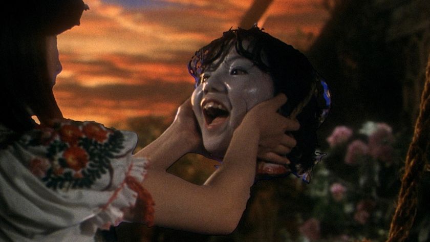 A girl&#039;s head smiling during one of the best scary movies, House. 