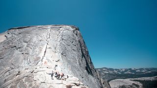 Hikers on the cable route of Half Dome