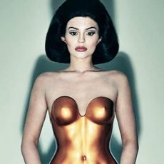 Kylie Jenner in a gold outfit for photoshoot 