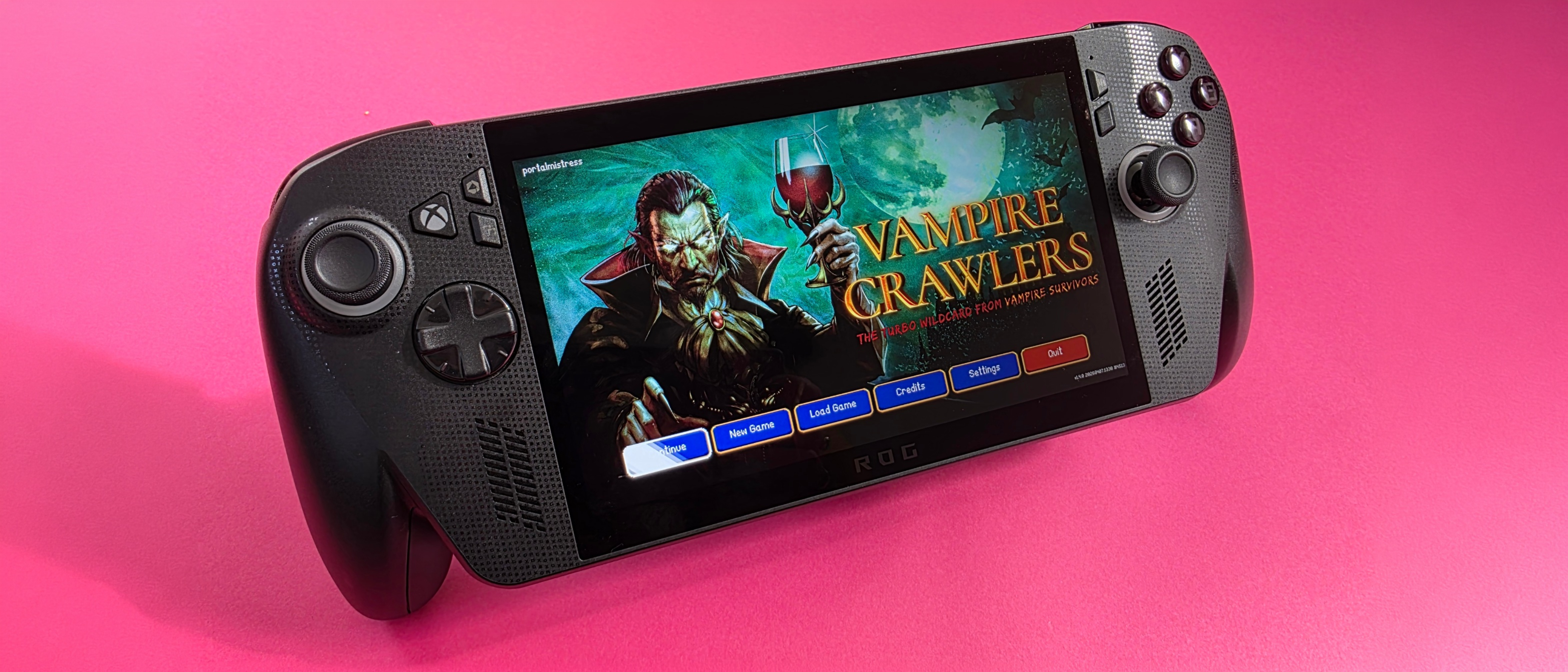 A handheld gaming console displays the start screen of "Vampire Crawlers," featuring a vampire holding a wine glass. Background is vibrant pink.