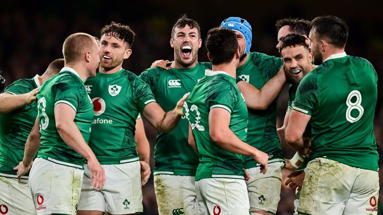 Caelan Doris of Ireland, centre, and team-mates celebrate at the final whistle of the Autumn Nations Series match between Ireland and New Zealand at Aviva Stadium in Dublin