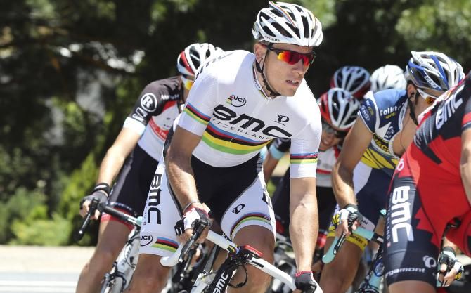 Philippe Gilbert races in his rainbow stripes