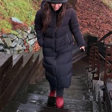 Olivia Rodrigo wearing a bucket hat and Aritzia puffer