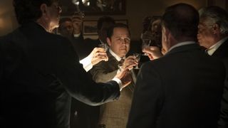 Giovanni Ribisi raises a glass with others in The Offer