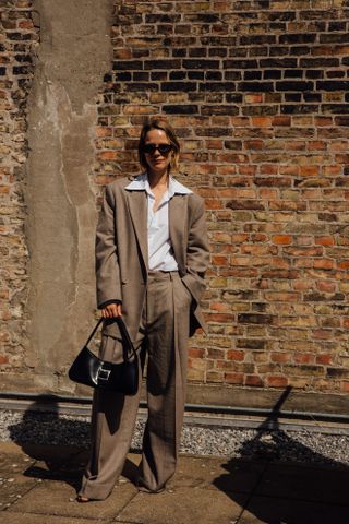 woman wearing suit and button-down shirt